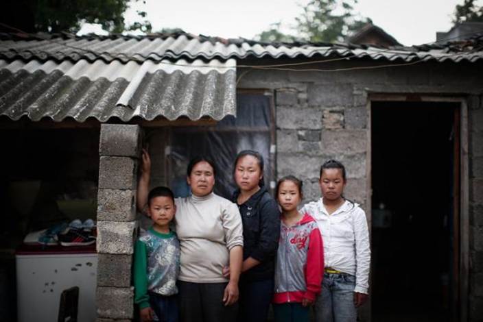 Like many poor farmers in China's Guizhou province, Wang decided to flout the country's one-child policy, seeing his children as valuable workers